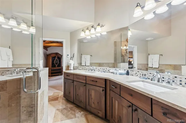 a spacious bathroom with a double vanity sink mirror and double