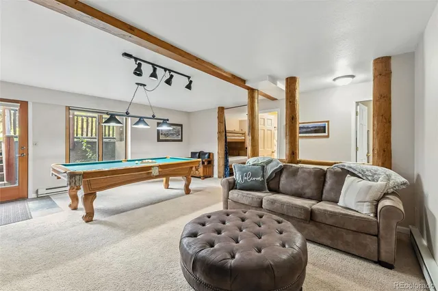 a living room with furniture and a rug