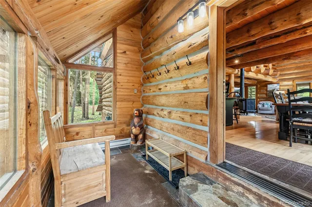 a room with wooden floor and furniture