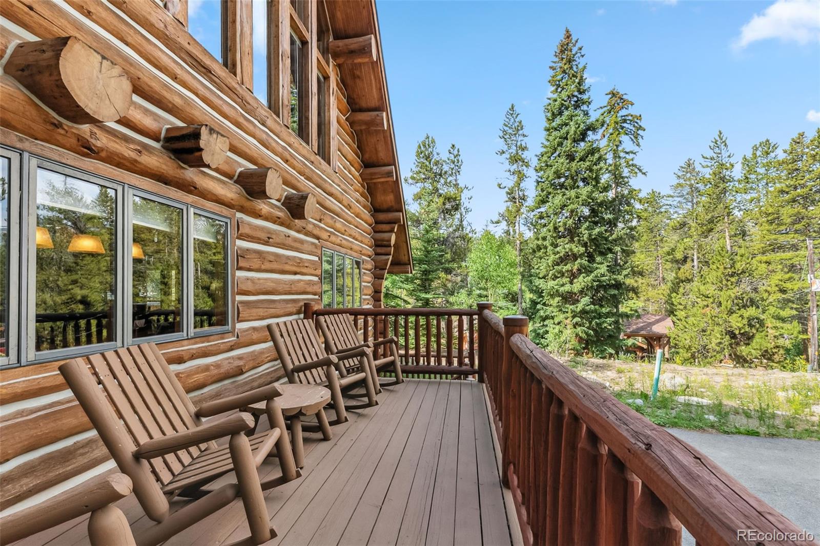 46 Indiana Creek Road Breckenridge, CO 80424 - Photo 44 of 50 a view of a balcony with two chairs and wooden fence