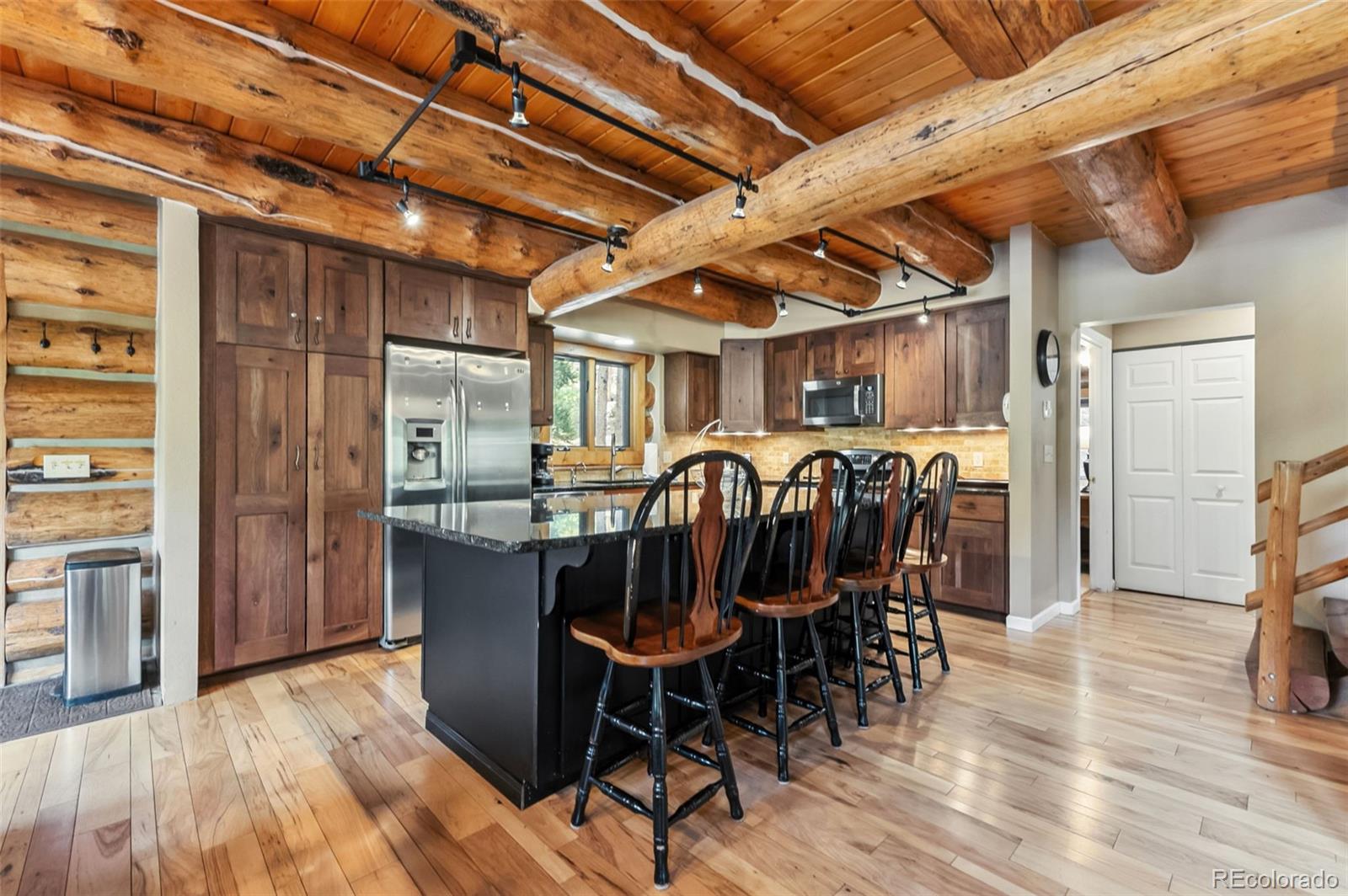 46 Indiana Creek Road Breckenridge, CO 80424 - Photo 7 of 50 a view of a dining room with furniture window and wooden floor