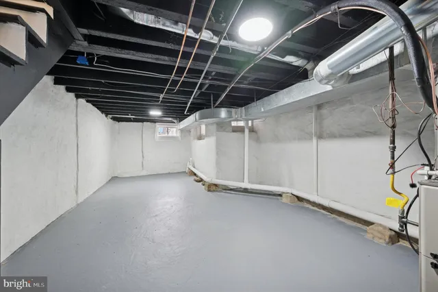 a view of empty room with wooden walls