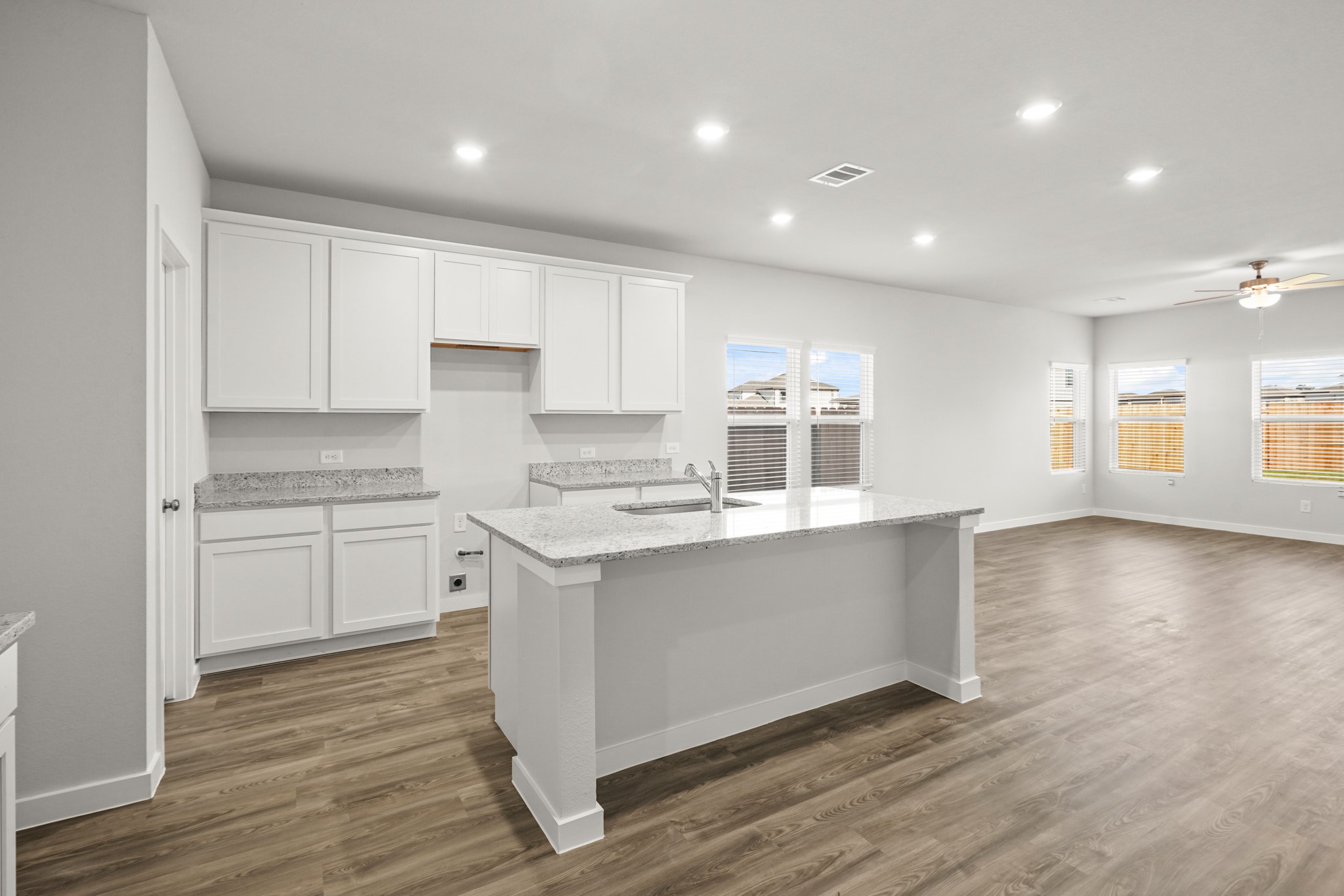 9720 Caney Bend Road Conroe, TX 77303 - Photo 3 of 24 a kitchen with stainless steel appliances granite countertop a stove and a sink