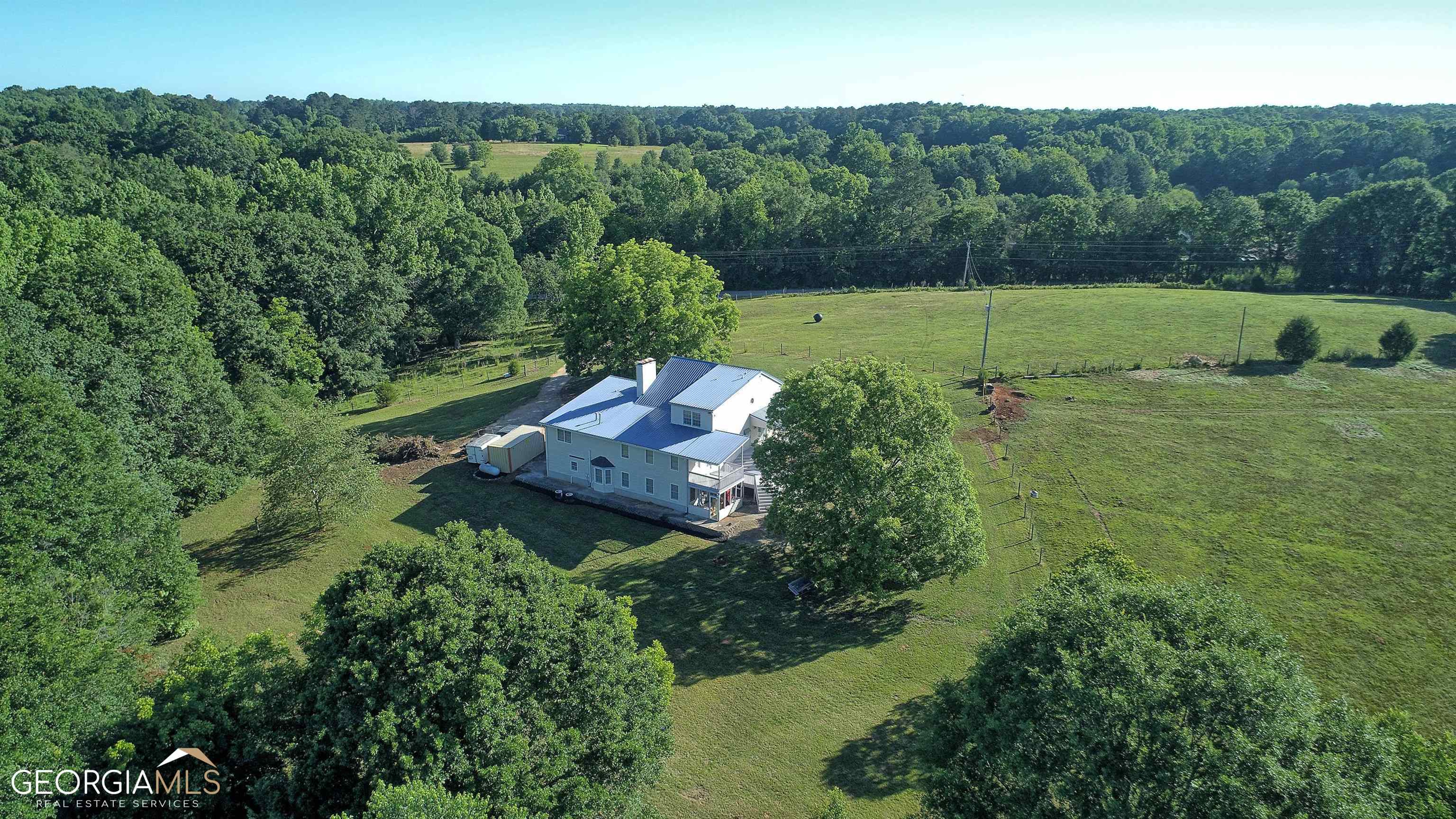 1059 Manley Road Griffin, GA 30223 - Photo 1 of 1 an aerial view of a house with a yard