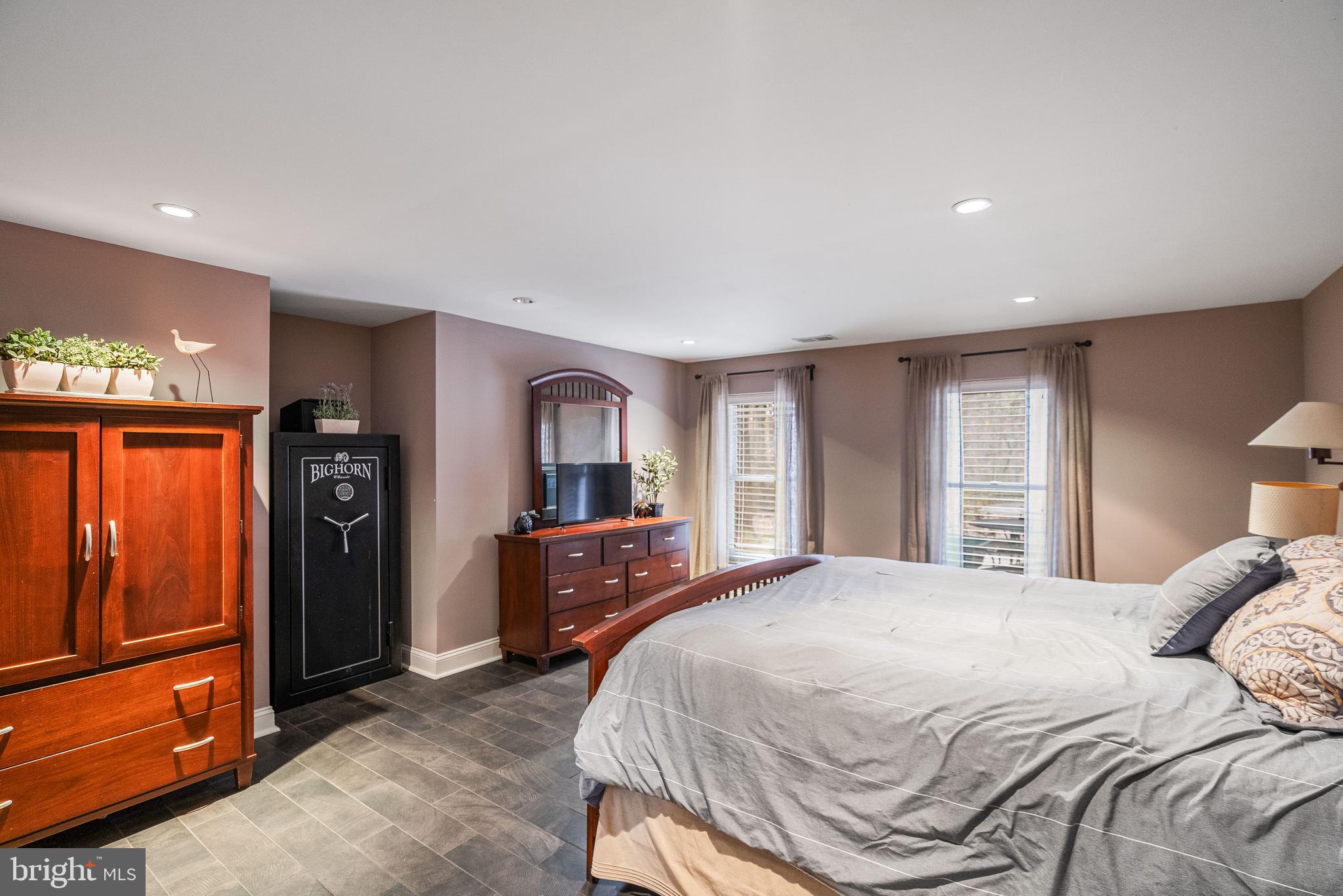 12106 North Walnut Branch Road Reston, VA 20194 - Photo 40 of 57 a bedroom with a bed and wooden floor