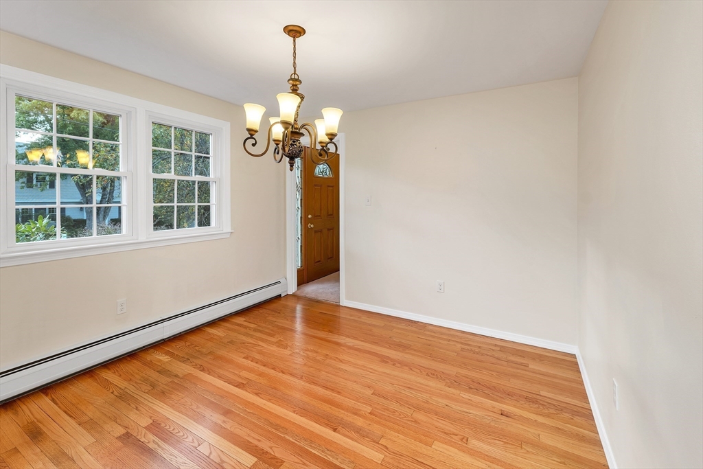 81 Magnolia Road Manchester, NH 03104 - Photo 15 of 35 a view of empty room with wooden floor and fan