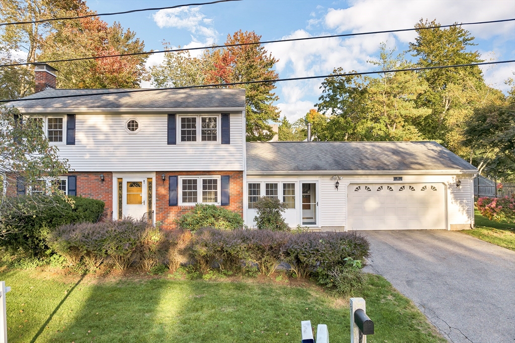 81 Magnolia Road Manchester, NH 03104 - Photo 2 of 35 a front view of a house with garden