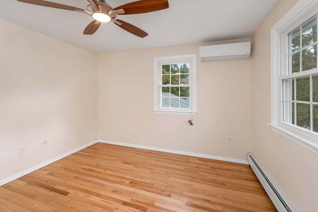 81 Magnolia Road Manchester, NH 03104 - Photo 23 of 35 an empty room with windows and fan