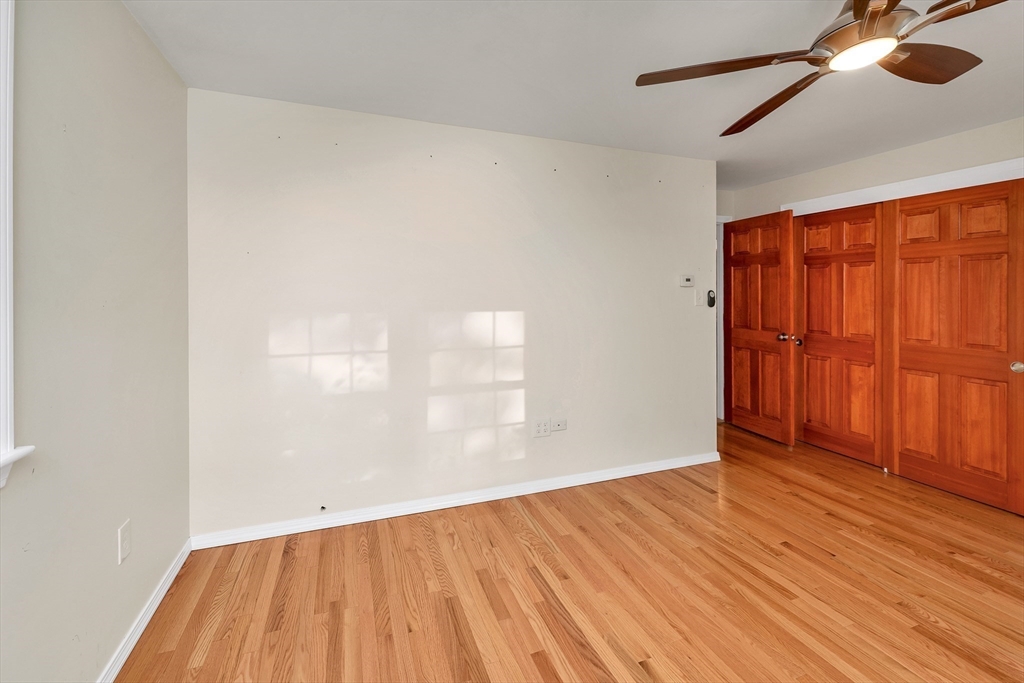 81 Magnolia Road Manchester, NH 03104 - Photo 29 of 35 an empty room with wooden floor closet and windows