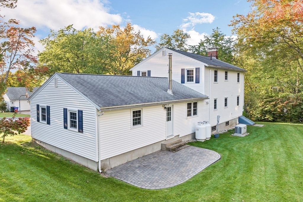 81 Magnolia Road Manchester, NH 03104 - Photo 3 of 35 a house view with a garden space