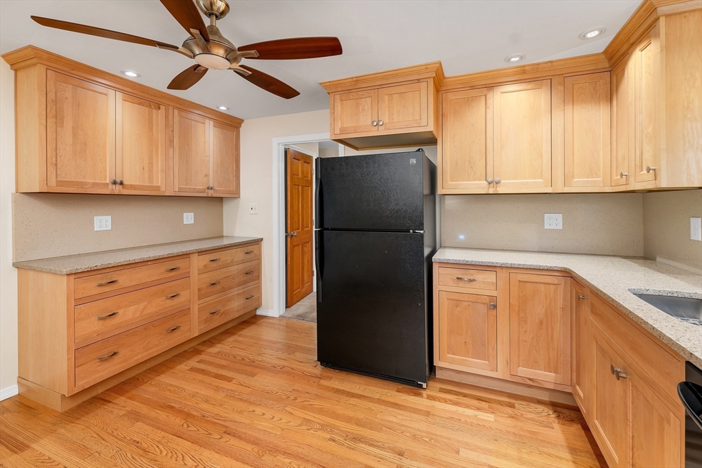 81 Magnolia Road Manchester, NH 03104 - Photo 10 of 35 a kitchen with a refrigerator and a stove