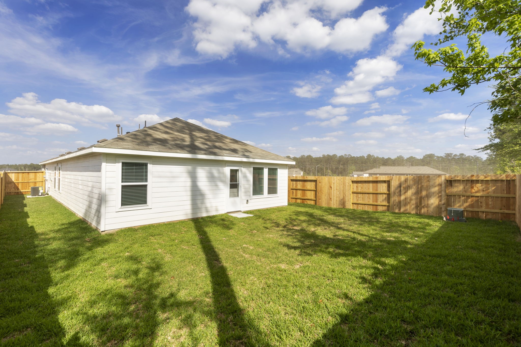 490 Southern Magnolia Way Magnolia, TX 77354 - Photo 22 of 25 a view of a house with a big yard and a fountain
