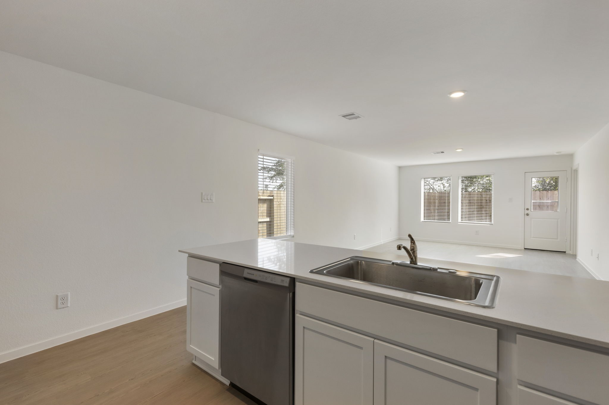 490 Southern Magnolia Way Magnolia, TX 77354 - Photo 9 of 25 a kitchen with a sink and cabinets