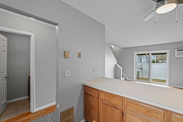 a hallway with windows and wooden floor