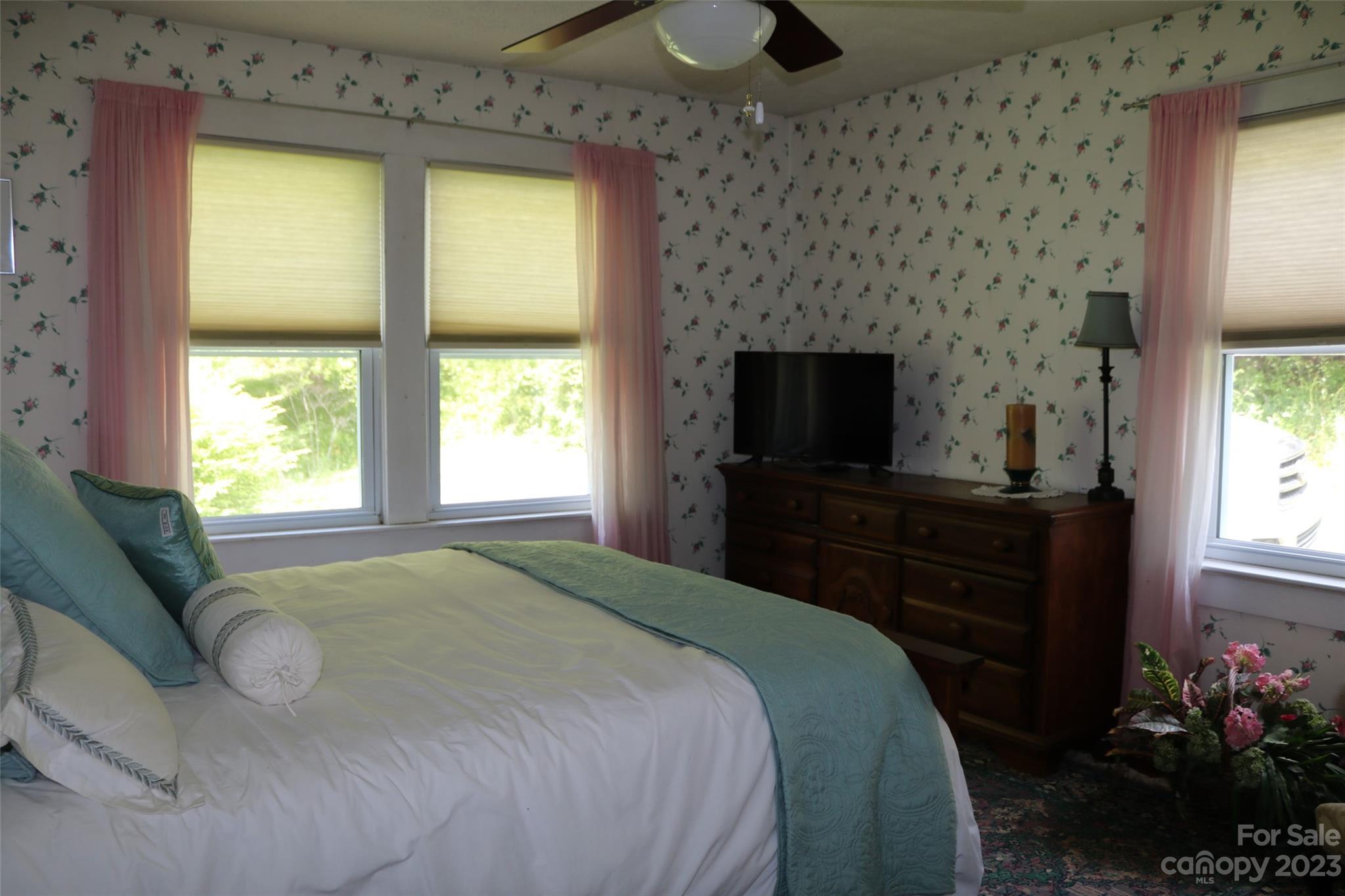 164 Rabbit Run Marshall, NC 28753 - Photo 11 of 27 a bedroom with a bed and a flat screen tv