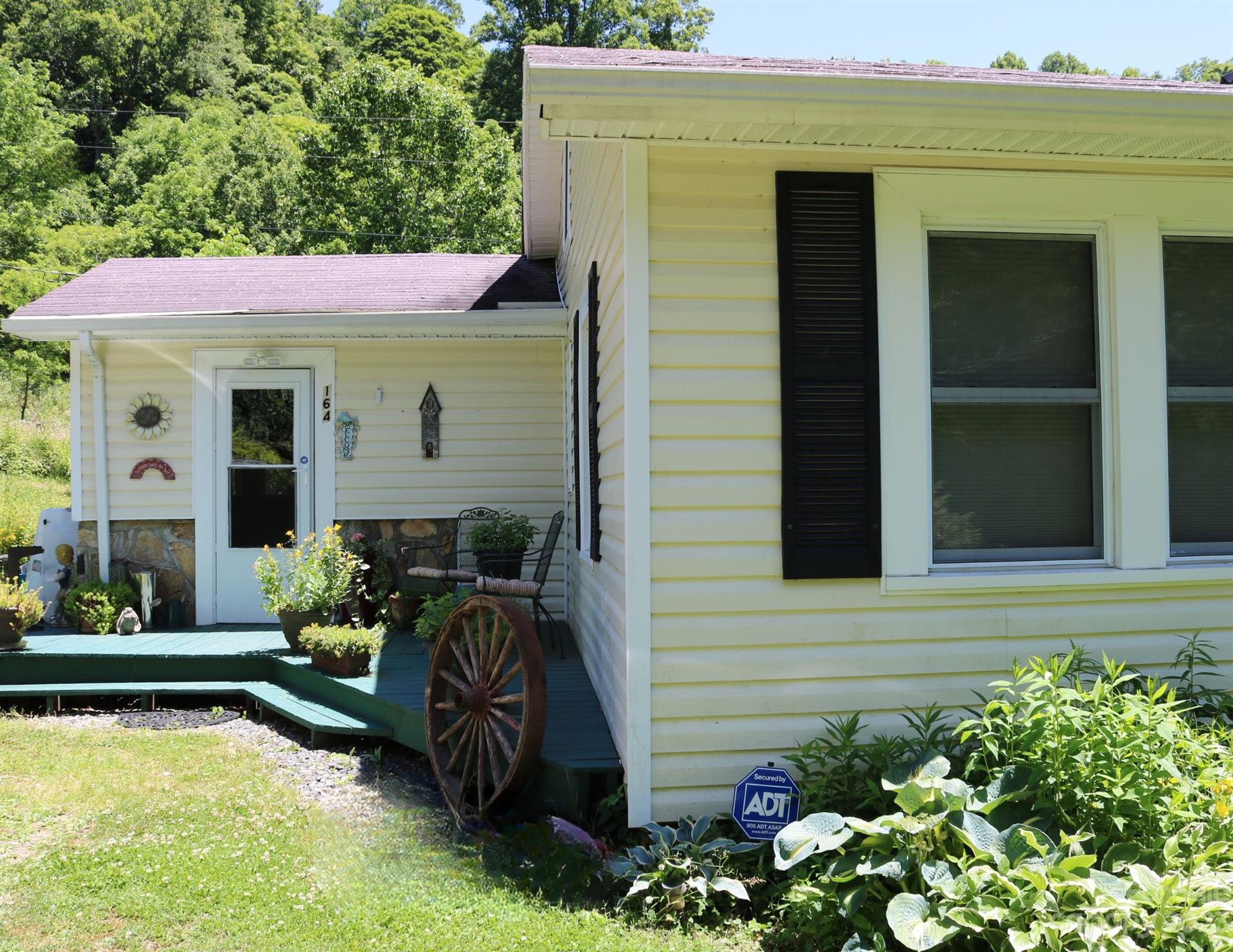 164 Rabbit Run Marshall, NC 28753 - Photo 2 of 27 a view of a house with swimming pool and furniture