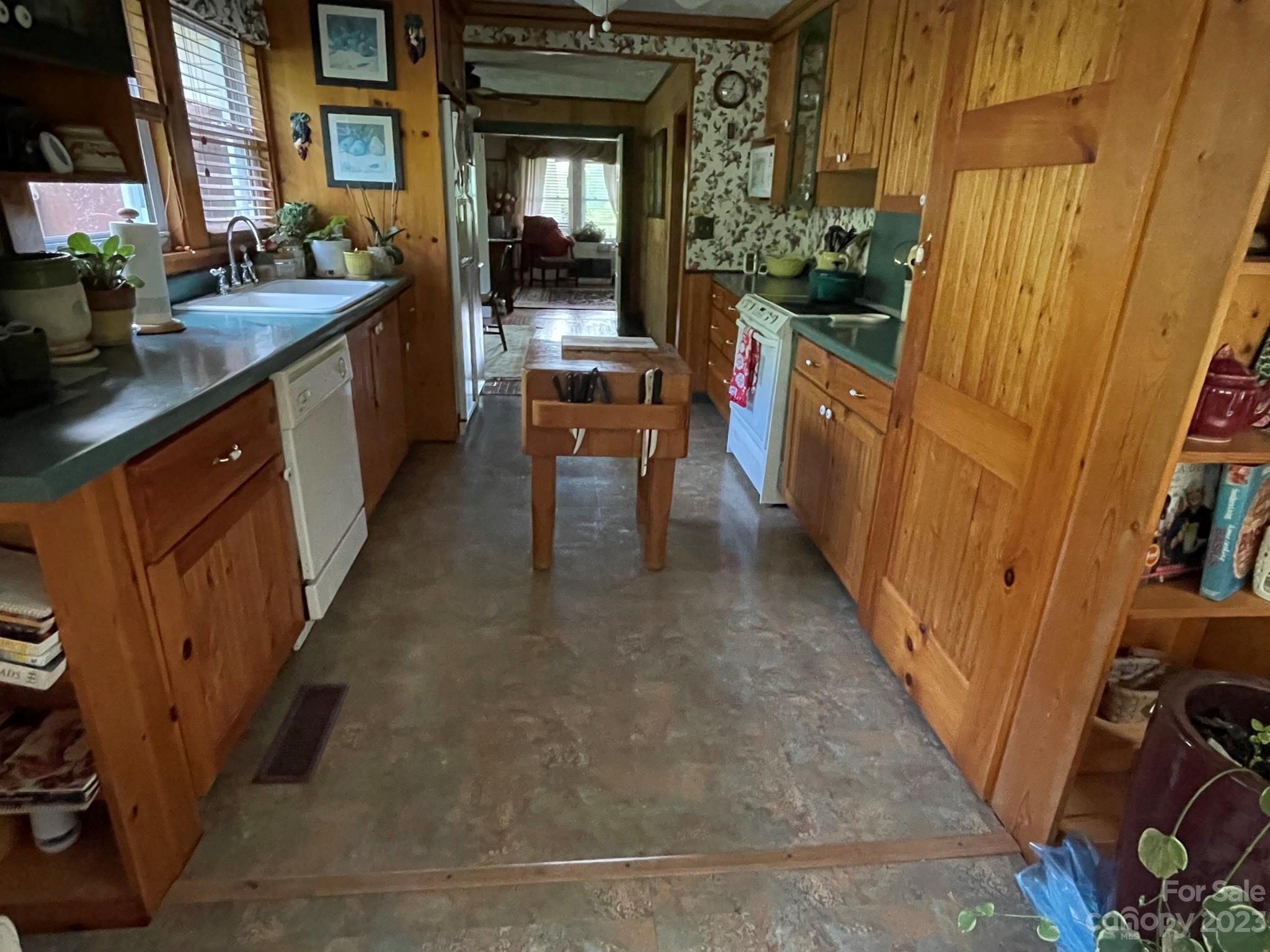 164 Rabbit Run Marshall, NC 28753 - Photo 4 of 27 a kitchen with sink a counter and cabinets