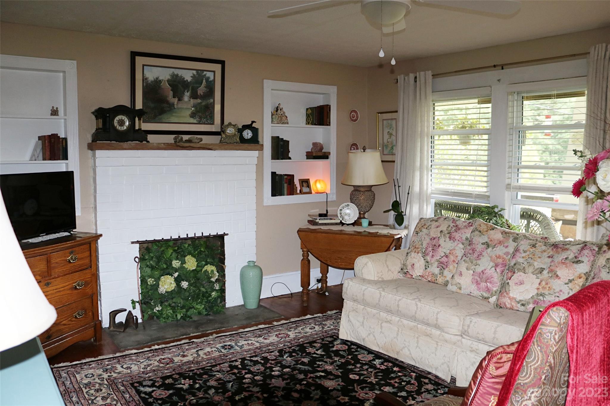 164 Rabbit Run Marshall, NC 28753 - Photo 7 of 27 a living room with furniture and a fireplace