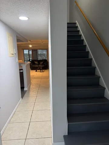 a view of entryway and kitchen