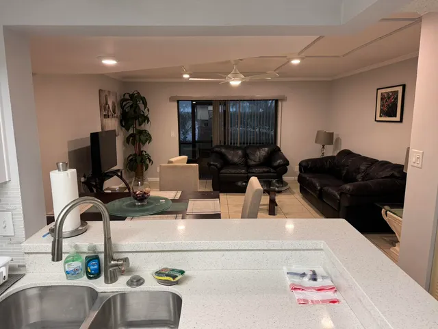 a kitchen with a sink appliances and cabinets