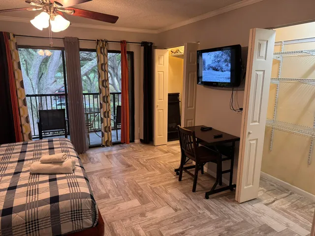 a bedroom with furniture and a window