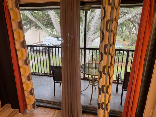 a view of an entryway with a door