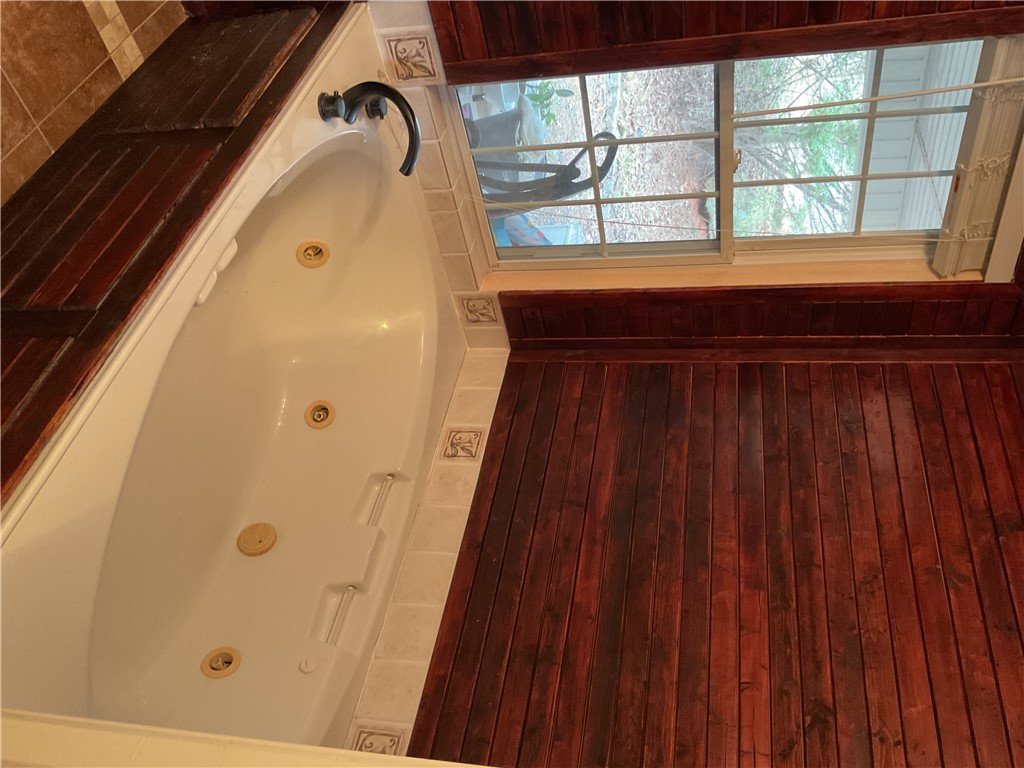 229 Cub Cove Drive Walhalla, SC 29691 - Photo 26 of 50 Relax and unwind in this inviting primary bathroom featuring a corner soaking tub.