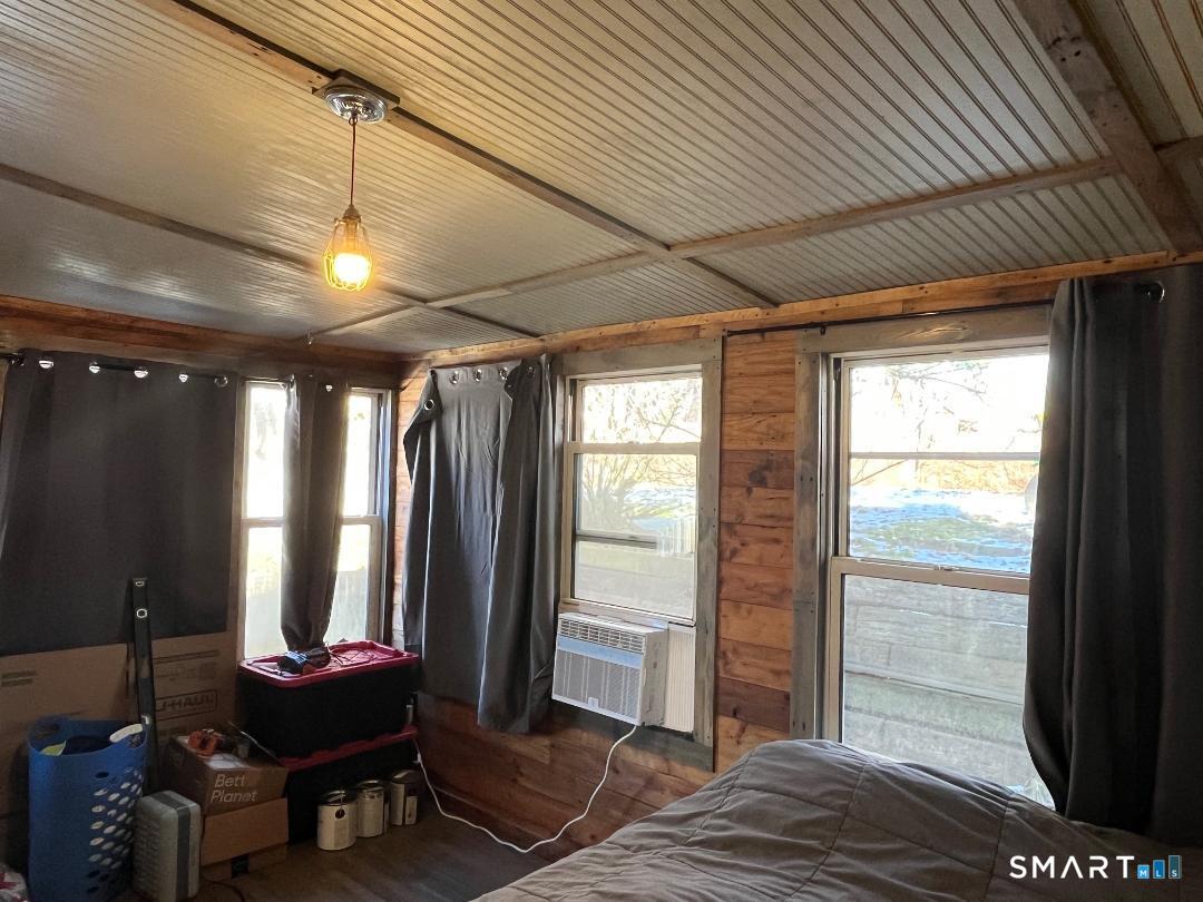 61 Tankerhoosen Road Vernon, CT 06066 - Photo 15 of 34 a living room with furniture and a window