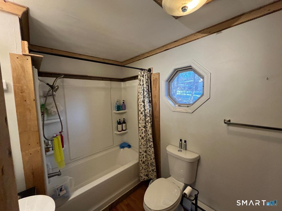 61 Tankerhoosen Road Vernon, CT 06066 - Photo 18 of 34 a bathroom with a toilet a sink and bathtub