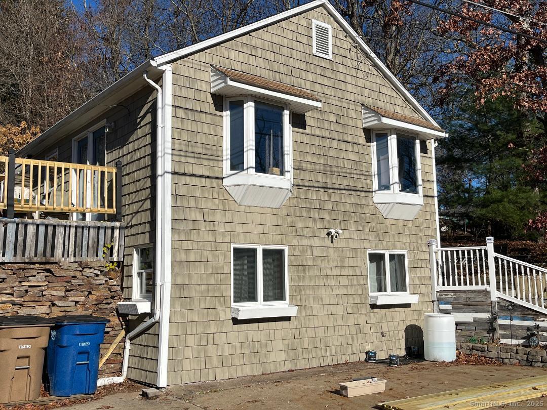 61 Tankerhoosen Road Vernon, CT 06066 - Photo 2 of 34 a front view of a house with a garage