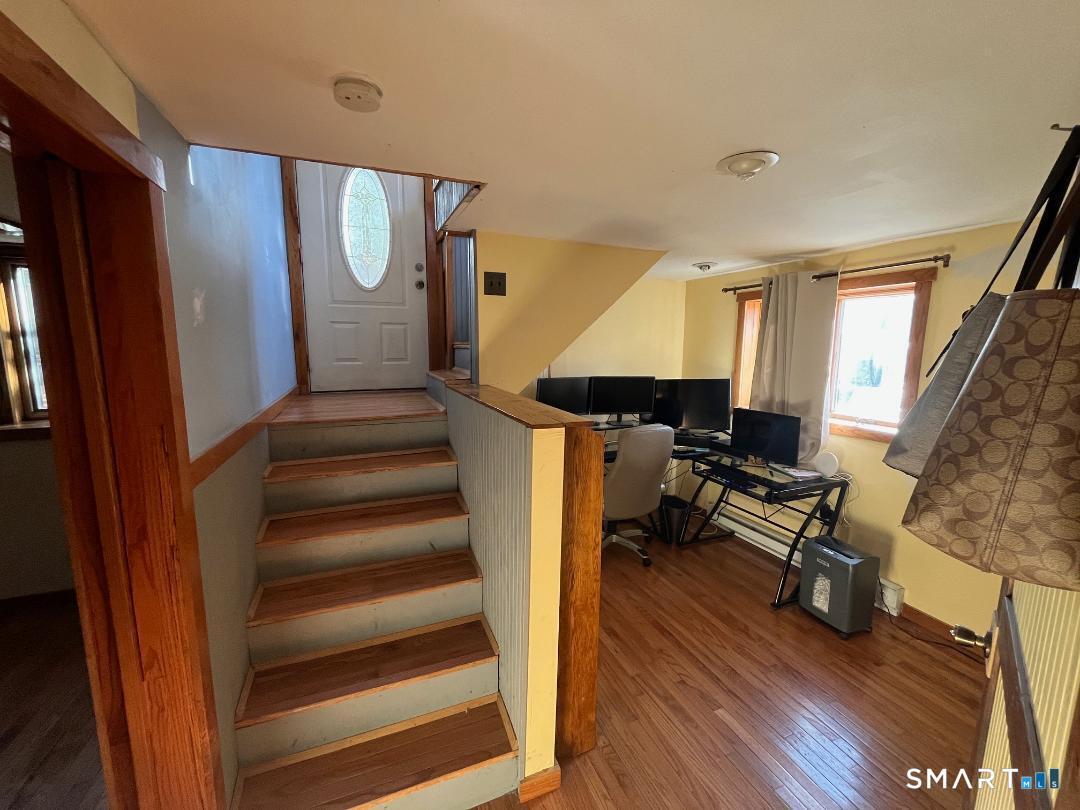 61 Tankerhoosen Road Vernon, CT 06066 - Photo 21 of 34 a view of entryway and hall with wooden floor