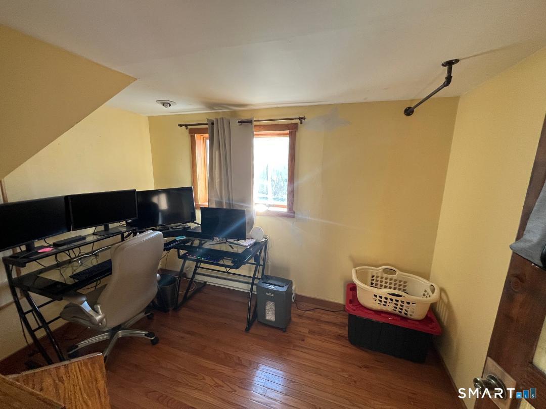 61 Tankerhoosen Road Vernon, CT 06066 - Photo 28 of 34 a workspace with furniture and wooden floor