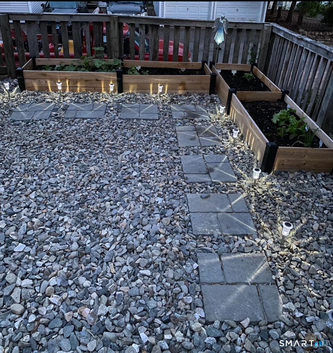 61 Tankerhoosen Road Vernon, CT 06066 - Photo 33 of 34 a view of a yard with wooden fence