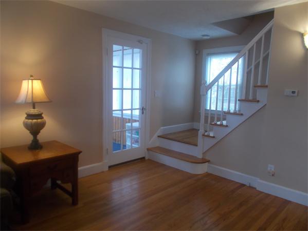 170 Lucerne Road Springfield, MA 01119 - Photo 12 of 28 a view of a livingroom with wooden floor and a potted plant