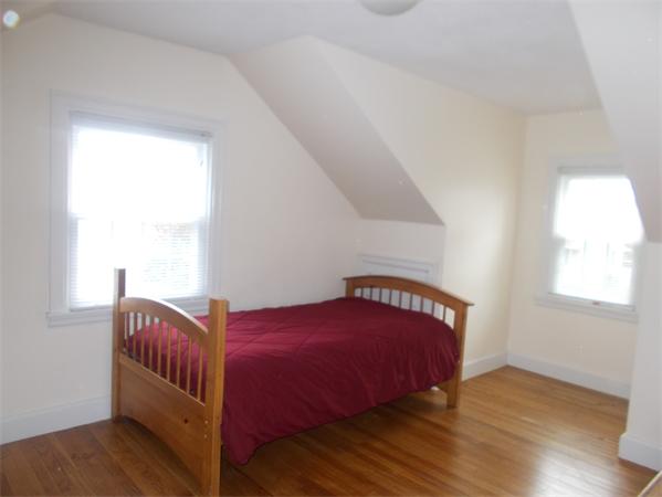 170 Lucerne Road Springfield, MA 01119 - Photo 17 of 28 a bedroom with a bed and wooden floor