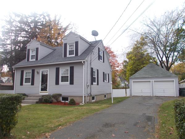 170 Lucerne Road Springfield, MA 01119 - Photo 4 of 28 a front view of a house with a yard and garage