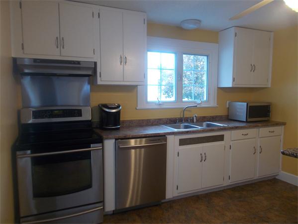 170 Lucerne Road Springfield, MA 01119 - Photo 8 of 28 a kitchen with stainless steel appliances granite countertop a sink stove and cabinets