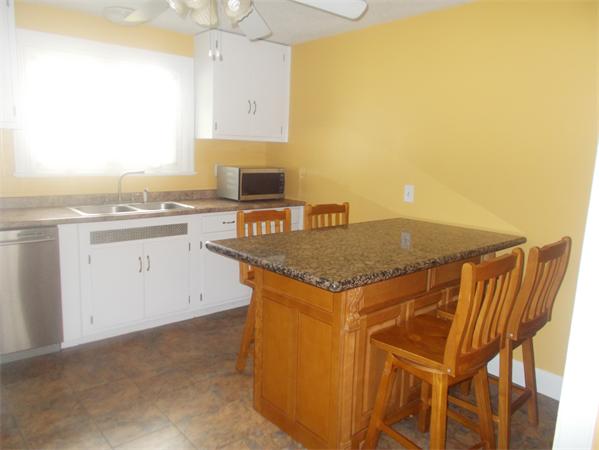 170 Lucerne Road Springfield, MA 01119 - Photo 9 of 28 a kitchen with a sink a stove and a refrigerator