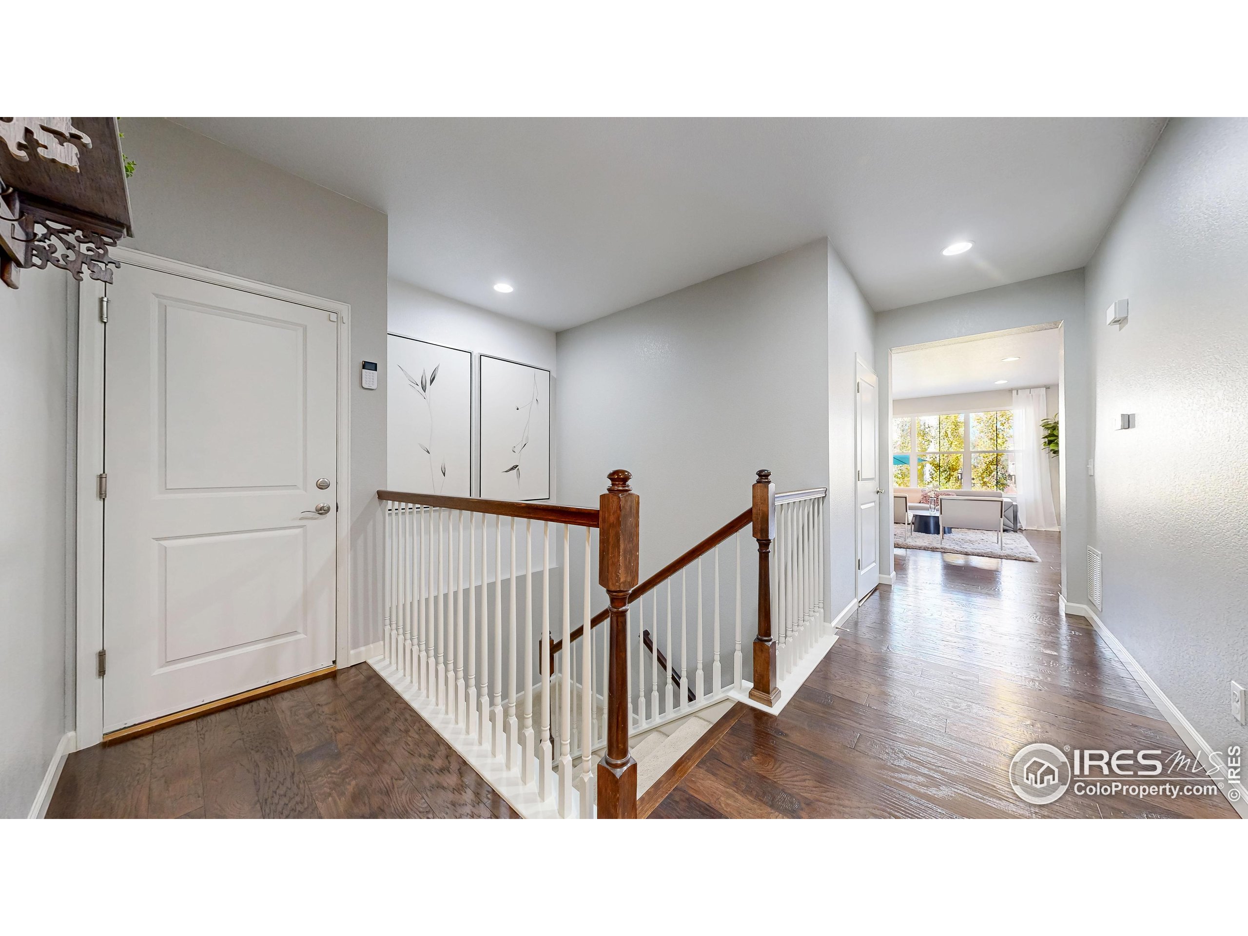 6794 Spring Rain Road Timnath, CO 80547 - Photo 14 of 49 a view of a living room and dining room