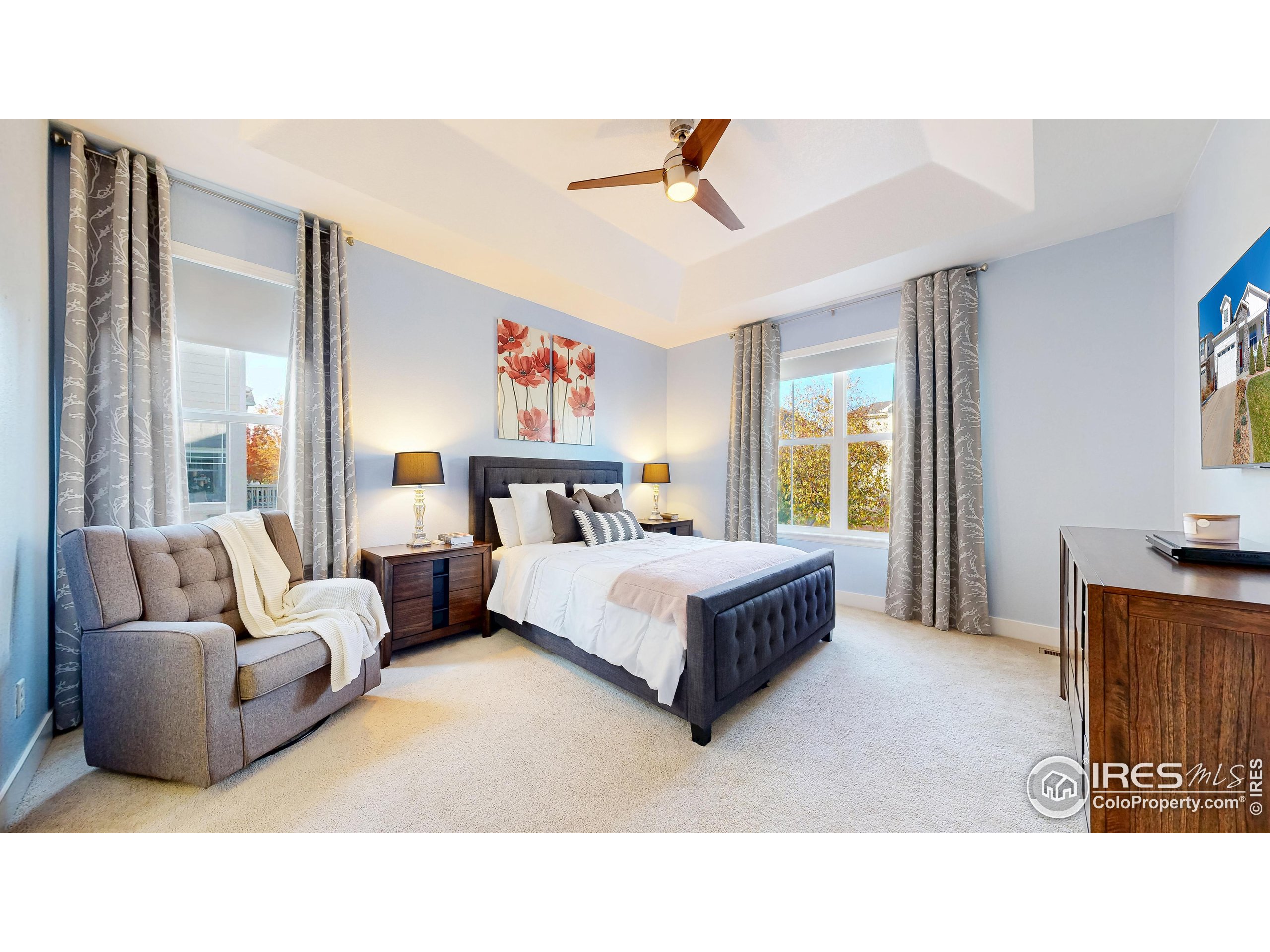 6794 Spring Rain Road Timnath, CO 80547 - Photo 20 of 49 a living room with furniture and a large window