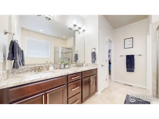 a bathroom with a sink double vanity and a mirror