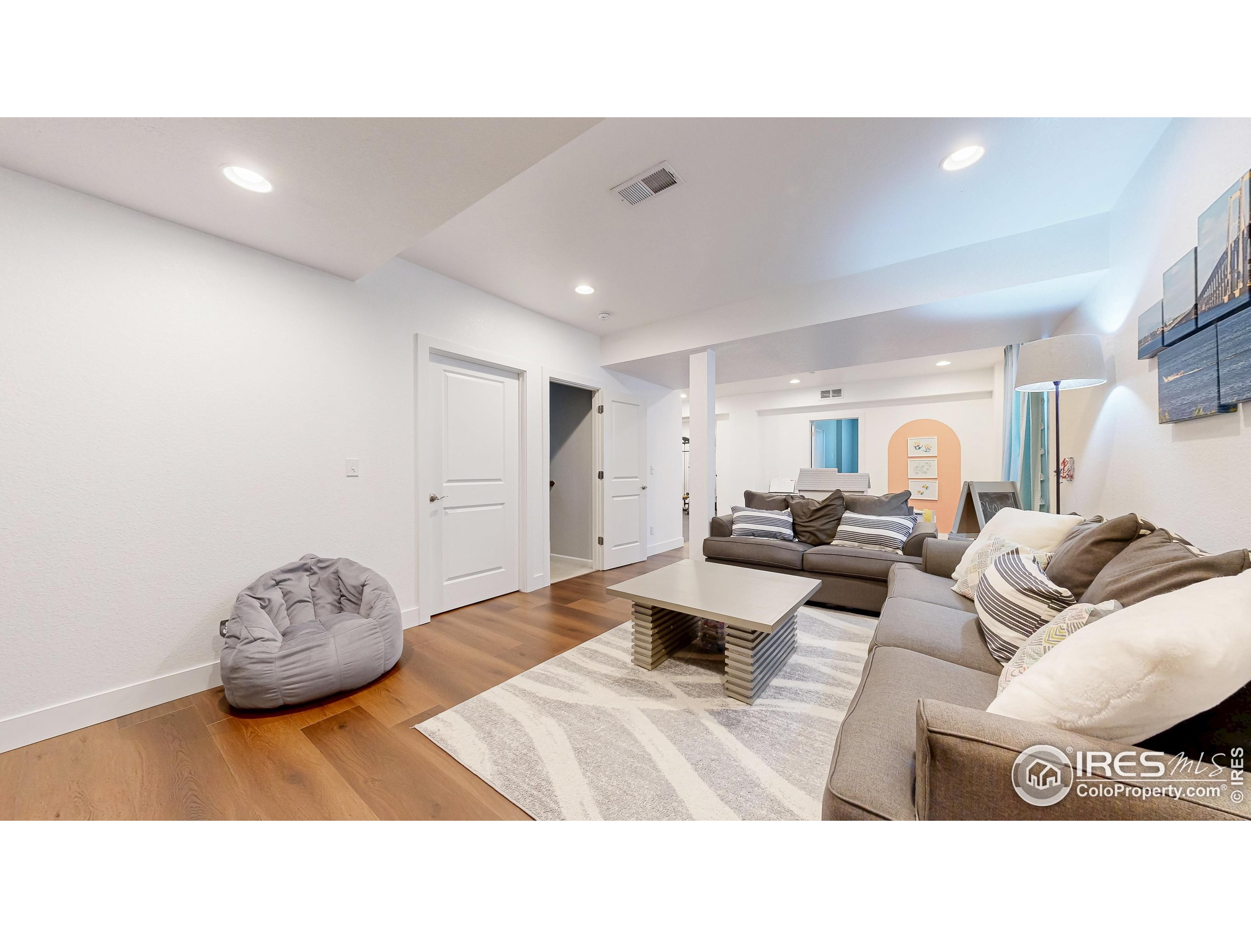 6794 Spring Rain Road Timnath, CO 80547 - Photo 29 of 49 a living room with furniture and a large window