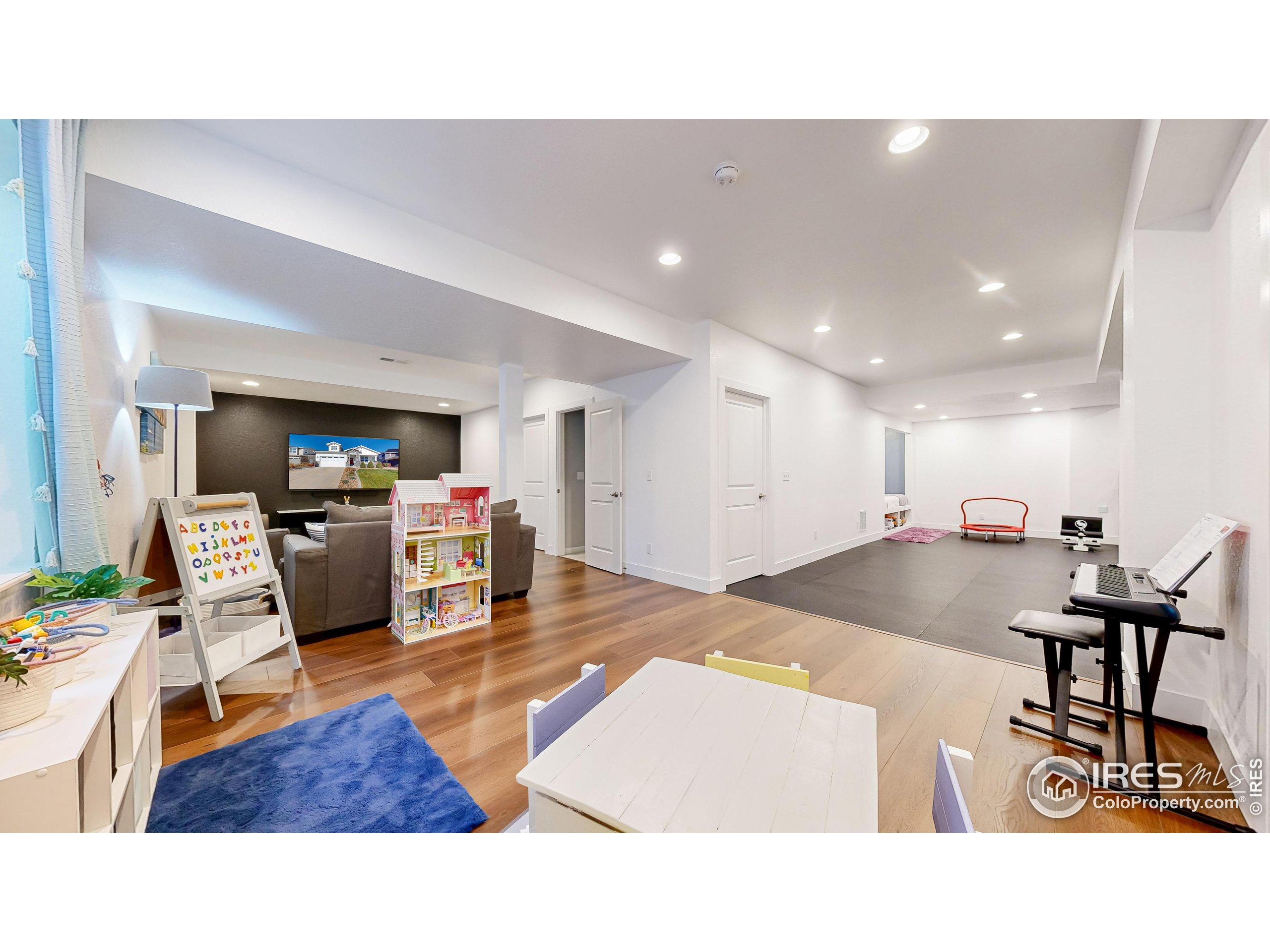 6794 Spring Rain Road Timnath, CO 80547 - Photo 30 of 49 a living room with furniture and a table