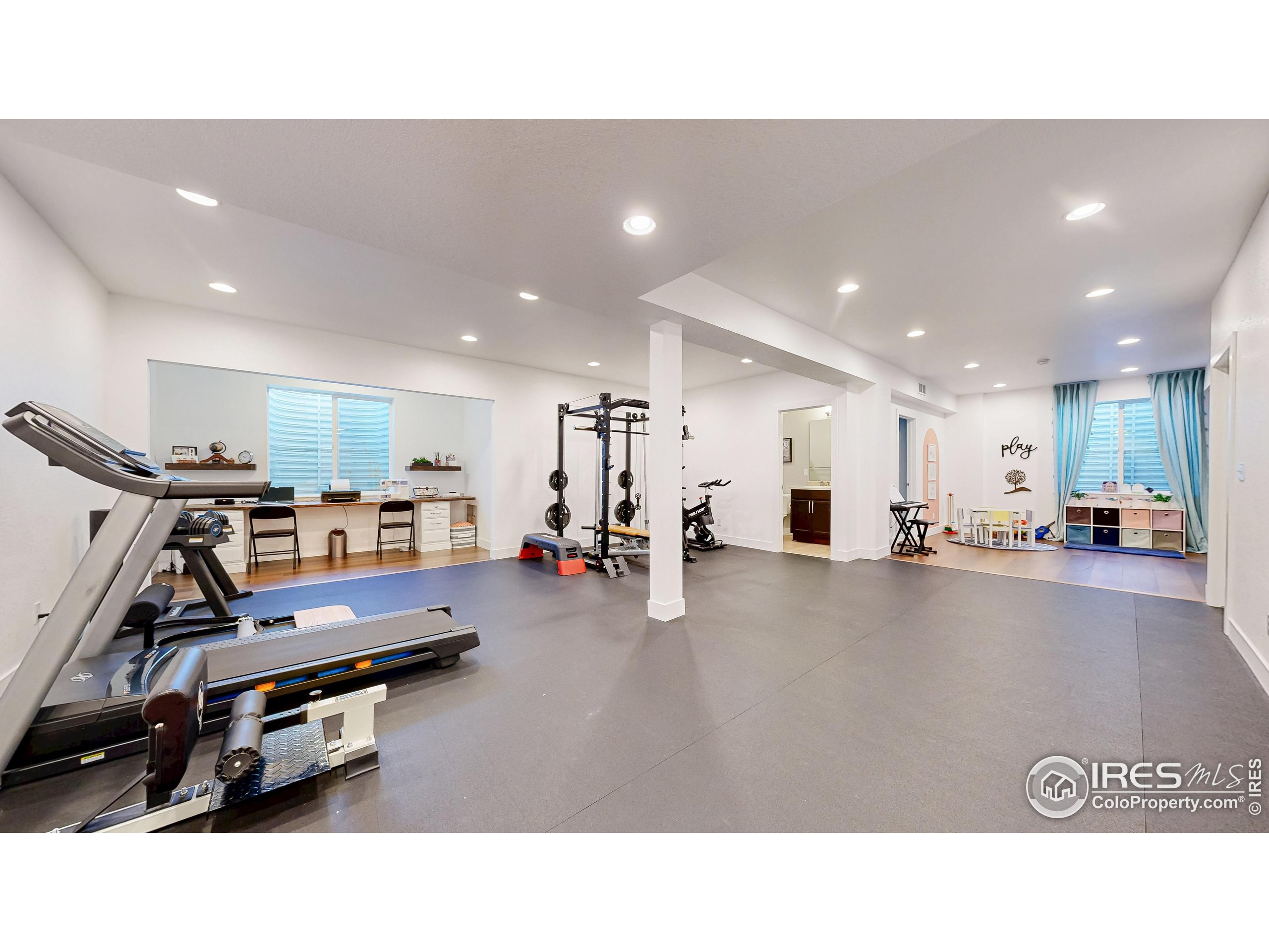 6794 Spring Rain Road Timnath, CO 80547 - Photo 31 of 49 a kitchen with a table and chairs