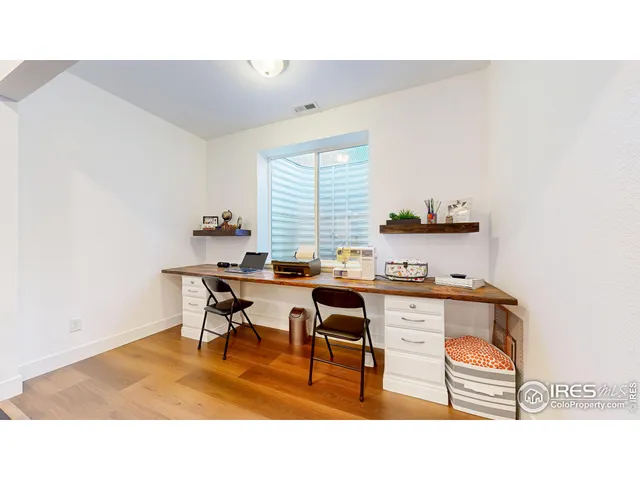 a kitchen with a table and chairs in it
