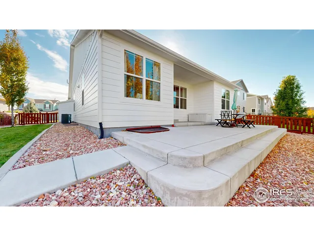 a outdoor space with lots of white furniture