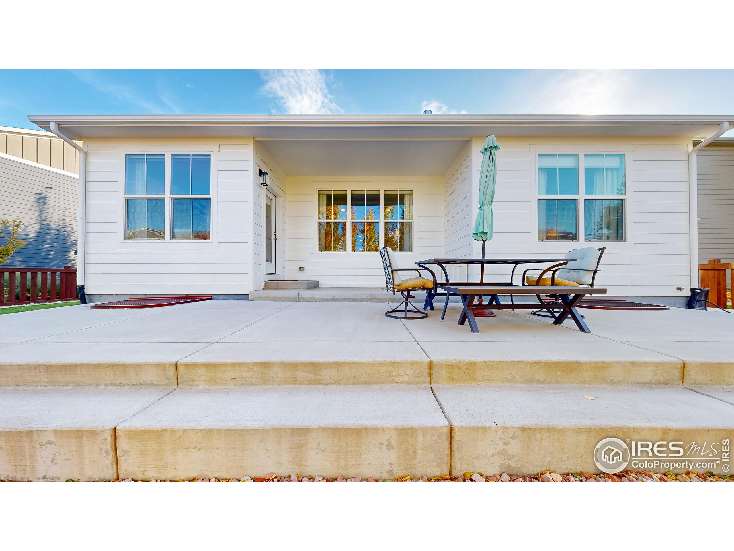 6794 Spring Rain Road Timnath, CO 80547 - Photo 41 of 49 a swimming pool with outdoor seating and a lots of sitting space