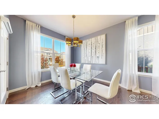a living room with furniture a table and a chandelier