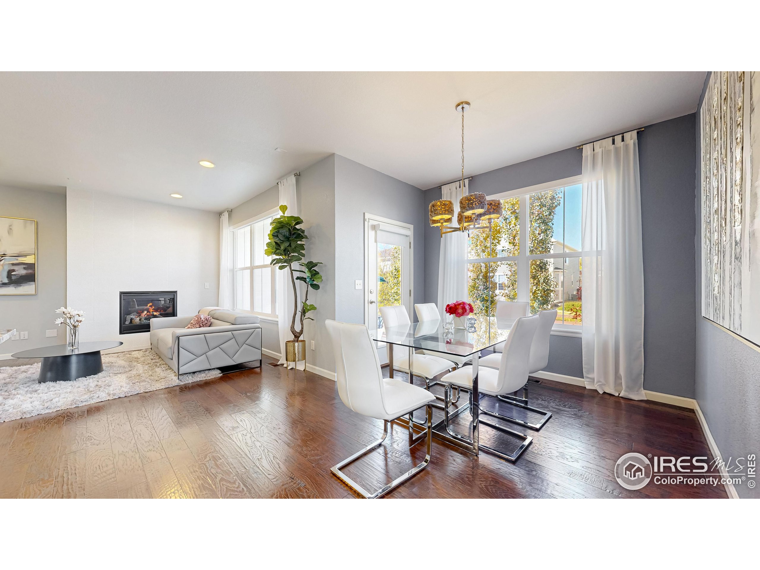 6794 Spring Rain Road Timnath, CO 80547 - Photo 7 of 49 a living room with furniture and a large window