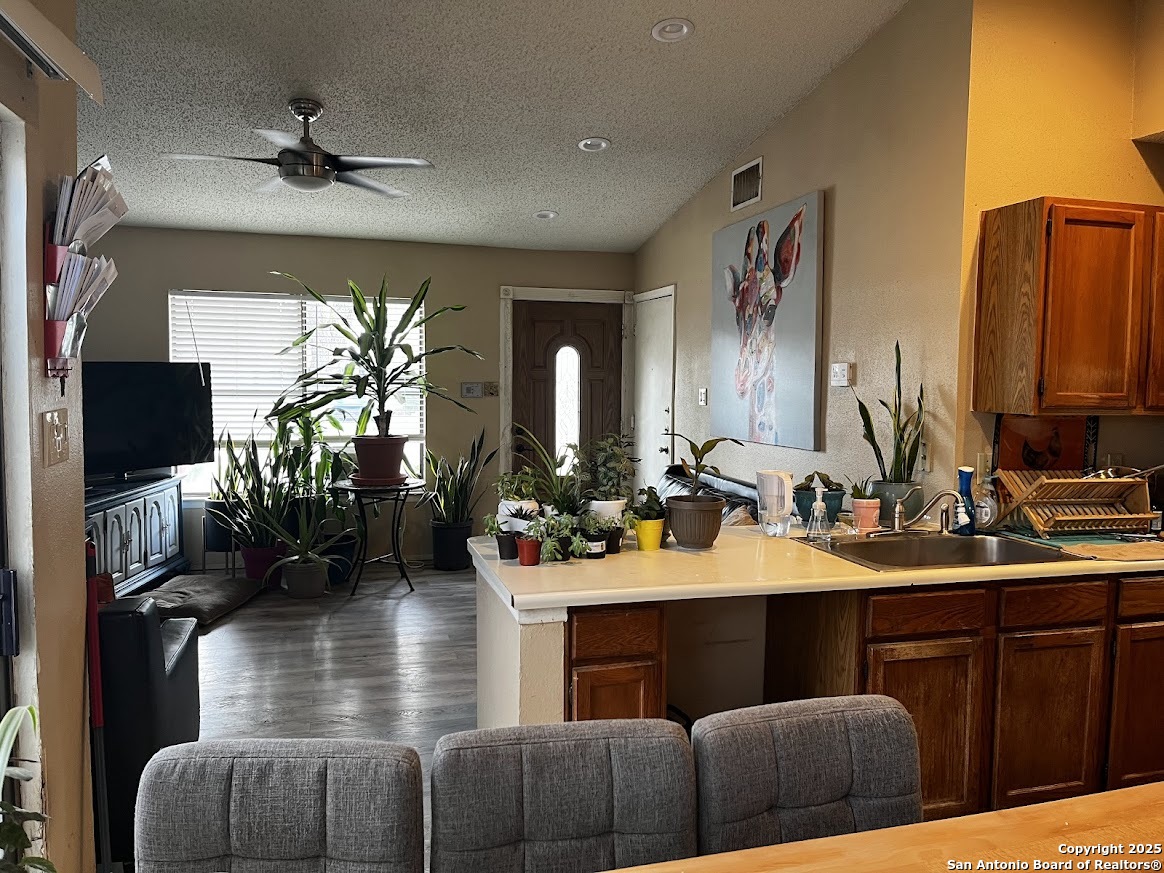 6613 Pebble Spring Drive San Antonio, TX 78249 - Photo 9 of 11 a view of living room with furniture and a flat screen tv